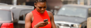 Woman from Ghana with cellphone