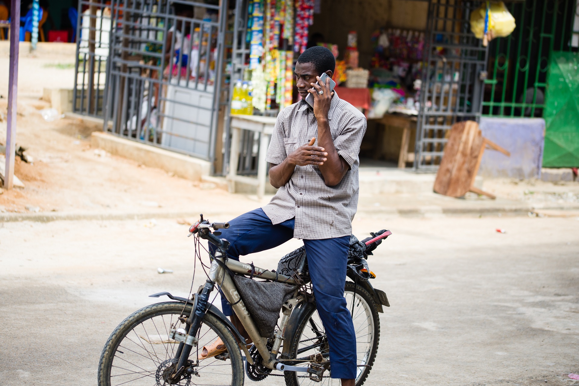 Man on a bike using mobile phone