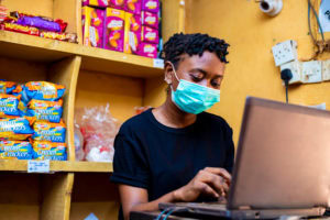 Store clerk wearing face mask